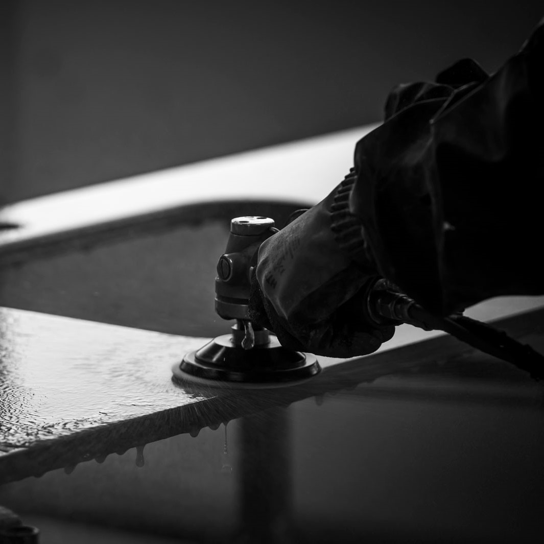 man polishing marble